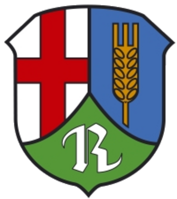 Das Wappen von Rüber ist gespalten durch eine eingeschweifte, gekürzte grüne Spitze, darin ein silbernes „R“; vorne in Silber ein rotes Balkenkreuz, hinten in Blau eine goldene Ähre.